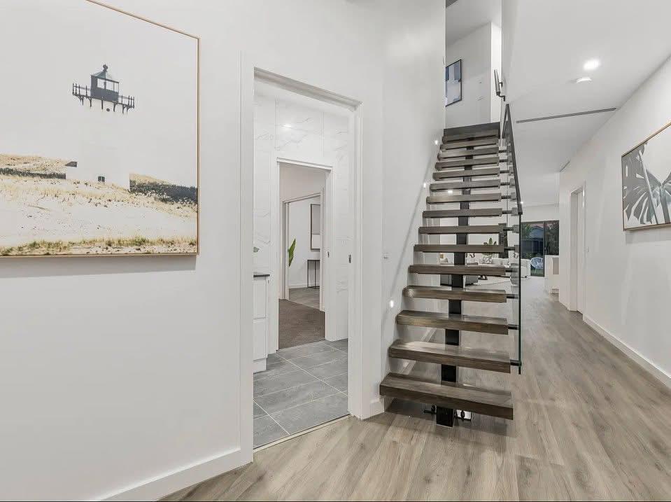 Modern home interior featuring Maison Glass & Aluminium's custom glass staircase and balustrade Modern home interior featuring Maison Glass & Aluminium's custom glass staircase and balustrade